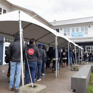 People lined up under canopies during the Pliny the Younger release at Russian River Brewing Company in Windsor (Christopher Chung/The Press Democrat)